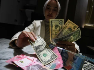 antarafoto-rupiah-ditutup-menguat-050-persen-1773270501